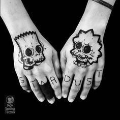 two hands with tattoos on them that say stardust and the other has a skull