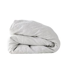 a white blanket folded up on top of a bed with the sheets pulled back and covering it