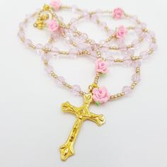 Baby pink, dainty Rosary. This piece would be a suitable gift for a girl's first communion, baptism or christening. Add a name with square letters to personalise. Give this as a gift or use it as you meditate on the mysteries of the Holy Rosary. These pieces are hand crafted to help promote the Rosary and encourage you with your devotion to your prayer life. If you need links and information on how to pray the Rosary i am happy to send you information. 51cm in length (when hanging) Does fit over Pink Beaded Jewelry For First Communion, Pink Beaded Jewelry For Baptism, Handmade Pink Rosary For Baptism, Handmade Pink Rosary For First Communion, Handmade Pink Jewelry For Baptism, Flower Rosary, Communion Gifts Girl, Beads Flower, Praying The Rosary