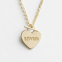 This 'Loved' gold identity necklace for children presents a pendant with an engraved message on the front—a reminder to the recipient how much she is loved by God and to celebrate who she is in Christ. This gold identity necklace displays the Scripture reference, Romans 8:39, on back of pendant. A perfect gift for any occasion. #ValentinesDayGifts #GiftsForHer #GiftsForGirls #BirthdayGift #GiftForChild #affiliate Romans 8 39, Loved By God, Jewel Candles, Christian Cross Necklace, Christian Greeting Cards, Valentines Day Gifts For Friends, Necklace Displays, Grow In Faith, Faith Jewelry