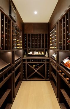 a wine cellar with lots of bottles in it