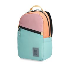 a backpack with two colors on the front and one color on the back, sitting against a white background