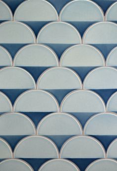 an abstract blue and white tile design