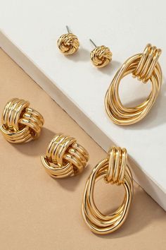 Crafted with sophistication and delicate detailing, our collection of Premium Trio Metal Knot and Hoop Earrings offers an elegant addition to any ensemble. Add a touch of understated beauty to your look with these three-piece earrings made from a luxurious blend of metals. With simple, timeless designs, these earrings harken... Classic Casual Style, 80s Jewelry, Spring 23, Bangles Design, Gold Bangles Design, Statement Accessories, Hoop Earring Sets, Chunky Rings, Knot Earrings