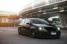 a black car parked in front of a building