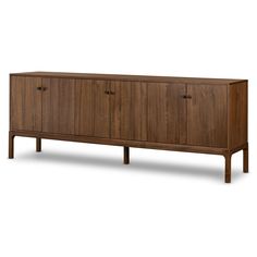 Inspired by campaign-style furniture of the 1800s â€” packable pieces first designed for traveling military use â€” a simply shaped sideboard of natural walnut features a subtly inset top and rounded legs, finished with wooden hardware Amethyst Home provides interior design, new home construction design consulting, vintage area rugs, and lighting in the Washington metro area. Campaign Style Furniture, Buffet Furniture, Modern Entertainment Center, Walnut Sideboard, Retirement House, Wooden Sideboard, Credenza Sideboard, Living Room Shop, Natural Walnut