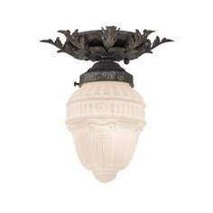 a light fixture with an ornate design on it