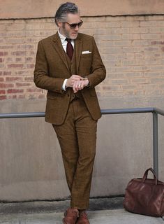 Venture into the essence of refined distinction with our Italian Highlander Mustard Herringbone Tweed Suit. Crafted from sumptuous wool, this masterpiece radiates with a vibrant mustard color, intricately woven with a striking black herringbone pattern that captivates and charms. It's not just attire; it's a declaration of style offering warmth and a luxurious texture that speaks volumes of its superior quality. Ideal for autumnal gatherings, prestigious business encounters or momentous celebrat Elegant Tweed Suit With Herringbone Pattern, Brown Fitted Tweed Suits, Brown Tweed Suit With Herringbone Pattern, Luxury Wool Herringbone Suit, Tailored Vintage Tweed Suit, Herringbone Tweed Jacket, Peaky Blinders Suit, Tweed Pants, Tweed Suit