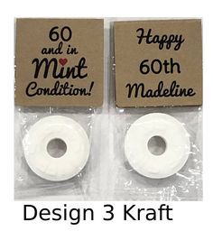 two white doughnuts sitting on top of each other in plastic wrappers with the words design 4 kraft