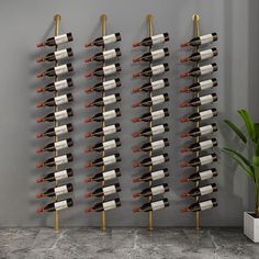 a wall mounted wine rack with many bottles