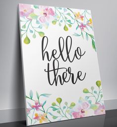 a sign that says hello there with flowers on it