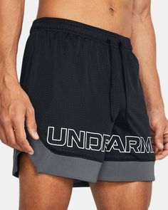 a man in black shorts with the word underarmm on it's side