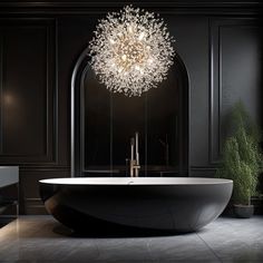 a bathtub with a chandelier hanging from the ceiling