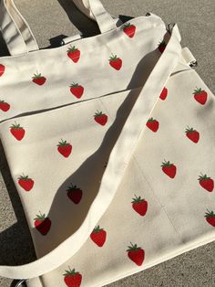 Berry Strawberry Tote Bag is an all strawberry design which falls under our multi purpose tote collection. It is designed with multiple pockets for better organization. It also includes one detachable adjustable strap for multi functional uses; you can adjust your bag wear into either a tote, crossbody or backpack depending on your preferences. We have upgraded our Berry Strawberry tote with better quality and stronger material. Our revamped tote bag now includes a double sided design. (front&ba Aesthetic Tote Bag Design, Cute Tote Bag Design, Strawberry Elephant, Bag Design Ideas, Tote Bag Ideas, Strawberry Tote Bag, Tote Bad