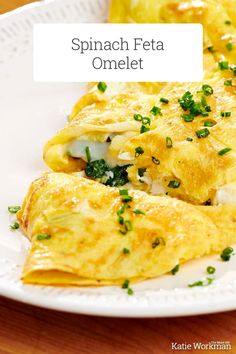 spinach feta omelet on a white plate with green garnish