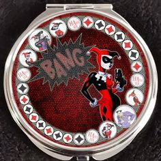 a compact mirror with an image of harley and the joker on it's face