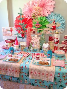 a table topped with lots of food and decorations