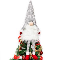 a christmas tree with a gnome decoration on it