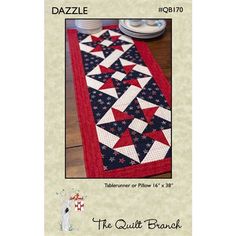 a table runner with red, white and blue quilting on the bottom that says dazzle