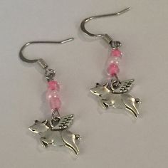 "Antique Silver \"When Pigs Fly\" Earrings, Flying Pig Earrings with Pink Seed Beads, Belief in Yourself and Anything is Possible Jewelry, Celebration of a wild dream waiting to be realized or Celebration of a hurdle leaped! Pig Charms: 15mm long, 10mm wide, 3mm thick Earrings can also be made with posts or hooks at no extra cost. Make sure to choose your earring clasp with your order. All Aspen Tree Jewelry is created in a smoke free environment and comes to you gift wrapped." Flying Pig Earrings, Fly Jewelry, Fly Earrings, Pig Jewelry, Pig Earrings, Pomegranate Earrings, When Pigs Fly, Pigs Fly, Fish Jewelry