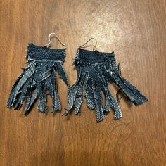 two pairs of black and white fringe earrings