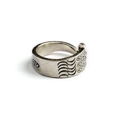 From our tribal collection, Hand made by Hill tribe artist from the Golden Triangle. A remarkable open band ring, hand carved oxidised silver with etched tribal motifs and a spiral tip. Adjustable in size and suitable for both, man and woman. Material: Silver Sizes : US 7 / 8 / 9 This handcrafted piece is 95% to 99% pure silver. The higher silver content (compared to sterling silver, which is 92.5%) makes the pieces softer and easier to shape. Oxidation, hammer marks, and slight design variances Engraved Silver Ring, Fake Gauge Earrings, Oxidized Silver Rings, Spiral Ring, Golden Triangle, Hill Tribe Silver, Snake Jewelry, Packing Jewelry, Ring Hand