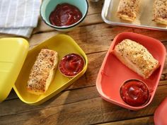 three different containers with food in them on a table