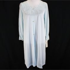 Vintage Lorraine Robe Size Small Blue In Color With Lace Trim 3/4 Length Sleeves Button Front Measures 19" (48.2 Cm) From Underarm To Underarm And Length Measures 38" (96.5 Cm) From Back Of Neck To Hem. Measurements Taken Across Front Of Garment With Garment Laying Flat 100% Nylon Care Instructions: Machine Wash, Tumble Dry Still Has Tags - Never Worn. Some Small Flaws On Back Of Right Shoulder - See Picture Blue Spring Sleepwear With Button Closure, Spring Blue Sleepwear With Button Closure, Blue Button Closure Sleepwear For Spring, Blue Long-sleeve Sleepwear With Buttons, Blue Long Sleeve Sleepwear With Buttons, Light Blue Long Sleeve Nightgown For Spring, Light Blue Long Sleeve Nightgown For Bedtime, Spring Buttoned Nightgown, Light Blue Long Sleeve Nightgown For Sleep