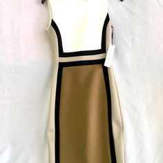 Calvin Klein Dress. Size 2. Sleeveless. A-Line Cream And Taupe Fitted With Black Stripes. Beige Fitted Sleeveless Midi Dress, Beige Stretch Sleeveless Knee-length Dress, Chic Fitted Brown Sleeveless Dress, Chic Stretch Sleeveless Dress In Beige, Chic Beige Stretch Sleeveless Dress, Elegant Beige Bodycon Sleeveless Dress, Chic Beige Sleeveless Dress With Stretch, Sleeveless Beige Lined Mini Dress, Chic Brown Stretch Sleeveless Dress