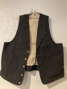 Cotton Button-up Vest With Buttons, Brown Cotton Vest With Button Closure, Vintage Cotton Vest With Button Closure, Cotton Vest With Snap Buttons For Work, Fitted Cotton Button-up Vest, Retro Cotton Vest With Buttons, Brown Cotton Vest With Buttons, Classic Cotton Vest With Button Closure, Retro Workwear Vest With Button Closure