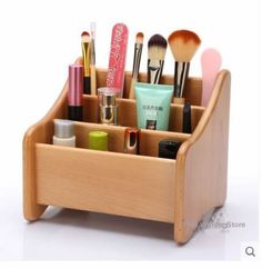 a wooden holder with makeup brushes and cosmetics