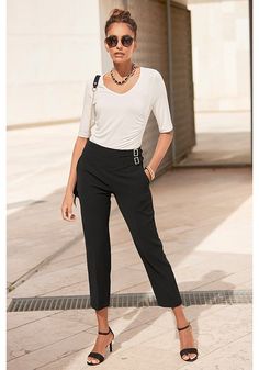 Find the perfect pair: These side buckle pants add a touch of coolness to your look. Casual High-waisted Pants With Belt Detail, Chic Bottoms With Belt Detail And Tapered Leg, Chic Tapered Leg Bottoms With Belt Detail, Chic Straight Leg Pants With Belt Detail, Chic Tapered Leg Pants With Belt Detail, Chic Office Pants With Belt Detail, High Waist Bottoms With Belt Detail For Night Out, Trendy Fall Bottoms With Belt Detail, Black High-waist Bottoms With Belt Detail