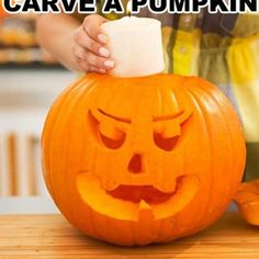 a person carving a pumpkin with the words how to carve a pumpkin on it