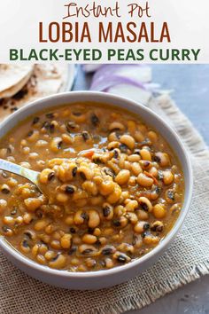 a white bowl filled with black eyed peas and tortilla chips on top of a table