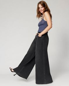 Embrace your soft side in our wide leg jeans, designed for the sweatpant lover. They hug you comfortably at the waist and then flare out like a 70's dream. Peep the special little front pocket made for your fave lip gloss. Dark Wash Flare Pants With Relaxed Fit, Chic Wide Leg Flare Jeans In Washed Black, Chic Wide Leg Washed Black Flare Jeans, Casual Wide Leg Flares For Fall, Casual Wide Leg Flares For Spring, Casual Wide-leg Flares For Spring, Versatile Medium Wash Wide Leg Flare Jeans, Versatile Medium Wash Wide-leg Flare Jeans, Versatile Wide Leg Flare Jeans With Five Pockets