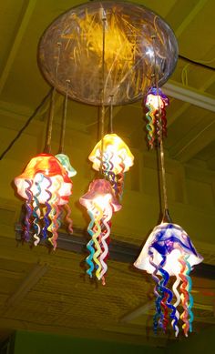 colorful lights hanging from the ceiling in a room