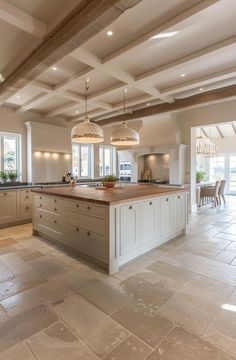 a large open kitchen with an island in the middle