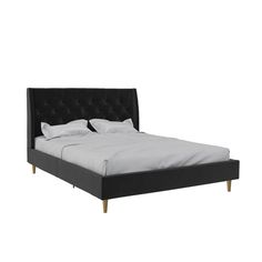 a black bed with white sheets and pillows on it's headboard, in front of a white background