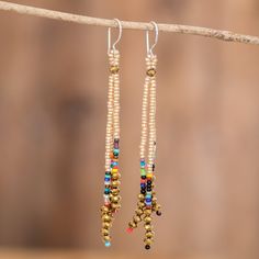 Lovely fringes made from gold and multicolored glass beads with amber crystal beads at the bottom set apart this pair of fabulous dangle earrings handcrafted in Guatemala. Artisan Mirian Zet threads the beads onto nylon cords which hang from gleaming sterling silver hooks in a design that is glamorous, versatile and timeless. Amber Crystal, Set Apart, Buy Crystals, Beaded Dangle Earrings, Beaded Dangles, Color Crystal, Hook Earrings, Guatemala, Crystal Beads