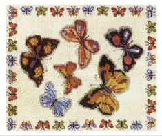 the rug has many different butterflies on it