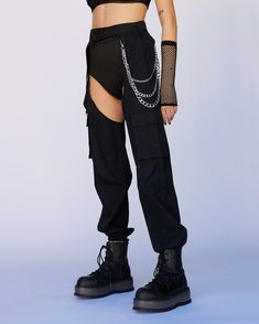 Our Darkest Hours Chain Chaps gotcha miles ahead of the rest, babe. Stunt on 'em in these badass black chap pants that feature an adjustable speed clasp closure, two side pockets, and removable chain details. Booty shorts not included Detachable chain clasps 100% Polyester Dry clean only