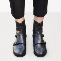 "These edgy combat boots with flap, two silver-toned buckles and laces for fastening are made for a polished androgynous look. These smart pair made from classic black leather will allow you to move from official day duties to eve vibes effortlessly. Outer and inner material - leather, closure - lace & buckle, heel 2.5 cm / 1.0\" --------Size Conversion & Feet Measurements------- EU 34 US 4.0 UK 1.0 | 22.5 cm / 8.85\" EU 35 US 5.0 UK 2.0 | 23.0 cm / 9.05\" EU 36 US 6.0 UK 3.0 | 23.5 cm / Black Boots Leather, Womens Fall Boots, Silver Decorations, Strap Boots, Androgynous Look, Womens Booties, Custom Made Shoes, Oxford Boots, Green Boots