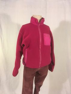 "vintage 1990s women's zip up fleece jacket Patagonia, made in USA 100% polyester trims -100% nylon 86% nylon, 14% spandex pink fuchsia w/purple trim zip up front/side pockets/breast pocket purple cordovan ribbon zipper pull tabs god vintage condition w/light wear zipper up front is a bit wavy (works fine) light wear fade on pocket trim (see photos) label size 10, see below measures, lying flat, shoulder-20\" chest-20 1/2\" sleeve-21\" hem-17 1/2\" to 19\" length-25\"     We do not offer returns or refunds unless something is grossly misrepresented. Please contact us within 2 business days of receiving to discuss any possible returns for this reason. We do not offer refunds for your shipping fees. Please feel free to contact us with any questions you may have about an item prior to purchas 90s Patagonia, Purple Trim, Pink Jacket, Womens Fleece, Fleece Jacket, Patagonia, Vintage 90s, Made In Usa, Zip Ups