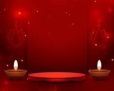 a red background with two lit candles in the middle and an empty plate on the bottom