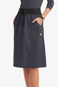 Our a-line scrub skirt gets an a+ from customers. Most-mentioned features? Perfect length. Classic but not “old-fashioned” style. Just-right fit. The comfy knit waistband. And it’s very easy to move in! each piece in our Butter-soft Stretch scrub collection was designed for 12+ hour shifts, and made from easy-care, 2-way stretch comfort fabric. • Classic fit • Natural wasited • A-line • Drawstring rib waistband • Knee length • 2 patch pockets • Approximate length for size M is 27” The key to com Scrub Skirt, Scrub Skirts, Scrub Collection, 12 Hour Shifts, Dickies Scrubs, Uniform Advantage, Medical Uniforms, Move In, Polyester Spandex