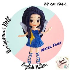 a crocheted doll with blue hair and yellow stars on her body is standing in front of a pink circle