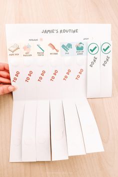 someone is holding up some white paper with stickers on it that read jamie's routine