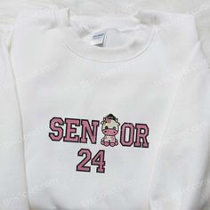 Senior 24 Sanrio Cow Embroidered Shirt White Cotton Shirt For Graduation, White Tops With Custom Embroidery For School Spirit, White Tops With Letter Embroidery For School, White Letter Embroidery Top For School, White Embroidered Letter Top For School, White Custom Embroidered Top For College, White Embroidered T-shirt For School, White Embroidered Tops For School Spirit, White Tops For Graduation At School