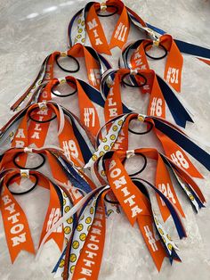 Ponytail Streamers are perfect to show off that team spirit! Perfect for matching uniforms, teams and even team moms! Choose between a 6 inch or 8 inch long steamer ponytail.  Each streamer comes with a mix of ribbed ribbon AND glitter ribbon. Please specify player name and number to be added on ribbon: Note: name and number is glitter lettering. If you do not want Glitter writing please specify in a message. Please note: if you do NOT want glitter ribbon, please specify in a message when orderi Hair Streamer, Ponytail Streamer, Softball Hair, Softball Bow, Softball Tournaments, Softball Hairstyles, Softball Gifts, Softball Team, Glitter Ribbon