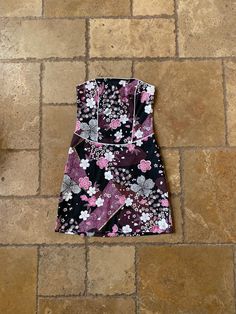 Vintage 1990s NWT Black & Pink Floral Mini Sleeveless Dress by Byer Too, tagged a size 3. Best fits a size XS. Made in the USA.  Measurements: Pit to Pit: 14" Waist: 13.5" Length: 26.25" Red Corset, Corset Style Tops, Floral Outfit, Floral Print Maxi Dress, Maxi Dress Formal, Floral Print Maxi, Corset Style, Floral Mini Dress, Printed Maxi Dress